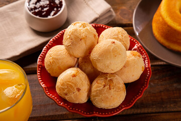 Brazilian cheese buns . Table coffee in the morning with cheese bread in basket.