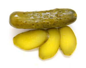 Fresh sliced green pickles isolated over white