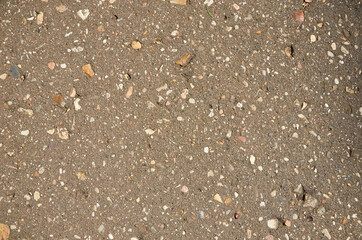 Texture of gray asphalt with white small stones