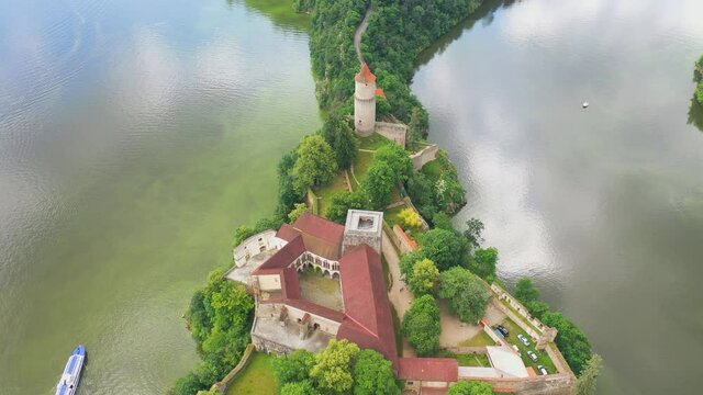 Aerial view on czech medieval castle Zvikov, situated on rocky outcrop above the confluence of two rivers Vltava and Otava, Czech republic