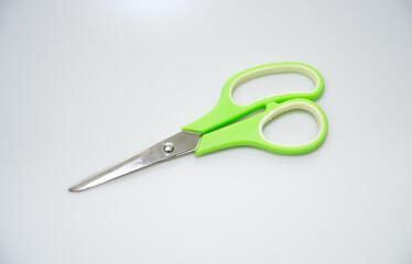 scissors on a green background