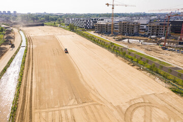 Aerial view of machinery and mine equipment near road on sandy surface. Warsaw Wilanow