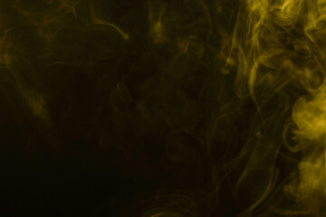 Yellow steam on a black background.