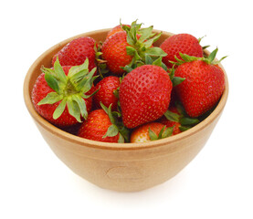 wood bowl with strawberries isolated on white background