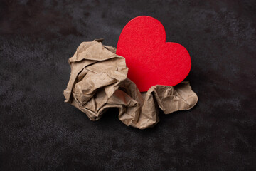 Heart shape in wrinkled paper. Valentine concept  promise of love