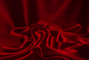 Red silk or satin luxury fabric texture can use as abstract background.