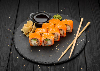 Philadelphia roll with fresh fish on black background