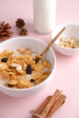Cereal dessert with corn oat and dry fruits isolated in pink background