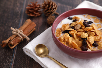 Cereal dessert with corn oat and dry fruits isolated in wood background