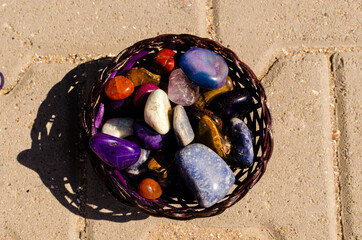 Basket full with colorful healing crystals