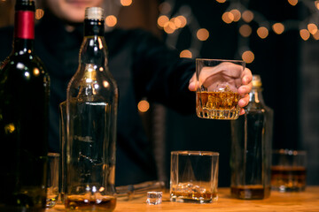 Barman pouring whiskey whiskey glass beautiful night
