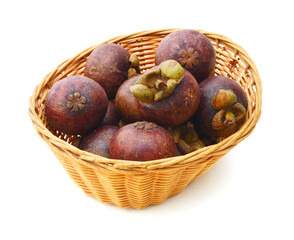 Obraz premium Mangosteen in basket on white background