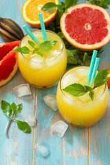 Summer menu drink. Orange and Grapefruit  refreshing drink with ice.