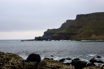 Fototapeta na wymiar Photo of the beach in Belfast during winter and a cloudy day in the Giants Causeway