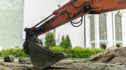 Fototapeta na wymiar construction excavator near the construction site