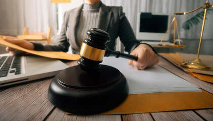 Business and lawyers discussing contract papers with brass scale on desk in office. Law, legal services, advice, justice and law concept picture with film grain effect