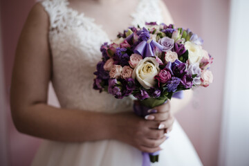 the bride's bouquet, bride holds a bouquet, bridal bouquet, bouquet of roses, wedding day, bride in a wedding dress