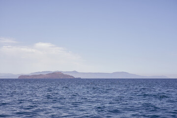 Obraz premium Rocky sea coast of Crete, Greece on a sunny day with clear sky.