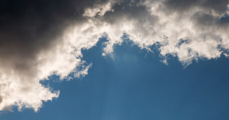 Beautiful sunset sky above the clouds with dramatic light. Sunset with dramatic clouds. The clouds.