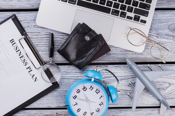 Rich businessman accessories on wooden table. Top view flat lay.