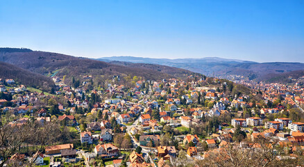 City panorama with beautiful houses in Wernigerode with the Harz Mountains in the background. Saxony-Anhalt, Germany