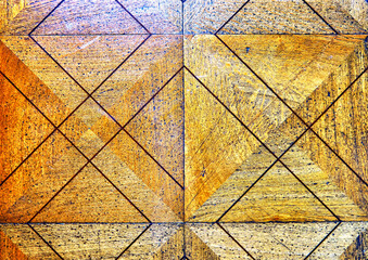 Old wooden floor parquet with diamond pattern as an antique background.