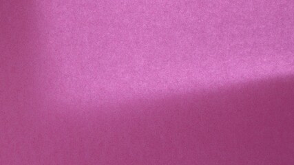 lilac-purple texture background with a noticeable grainy relief of the surface and the play of light and shadow
