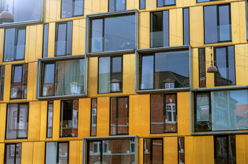 Closeup of a modern yellow highrise building