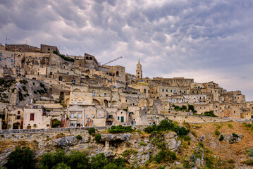 Fototapeta na wymiar Matera is a city in Italy. The Sassi di Matera, is a complex of cave dwellings carved into the ancient river canyon, often cited as 
