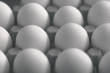 Packaging of white eggs in dark depressing colors.
