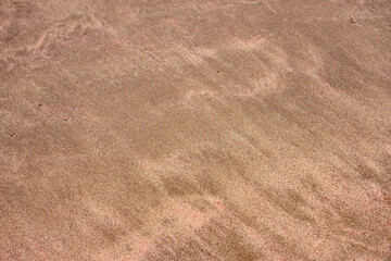 Sand on tropical beach as a natural background.