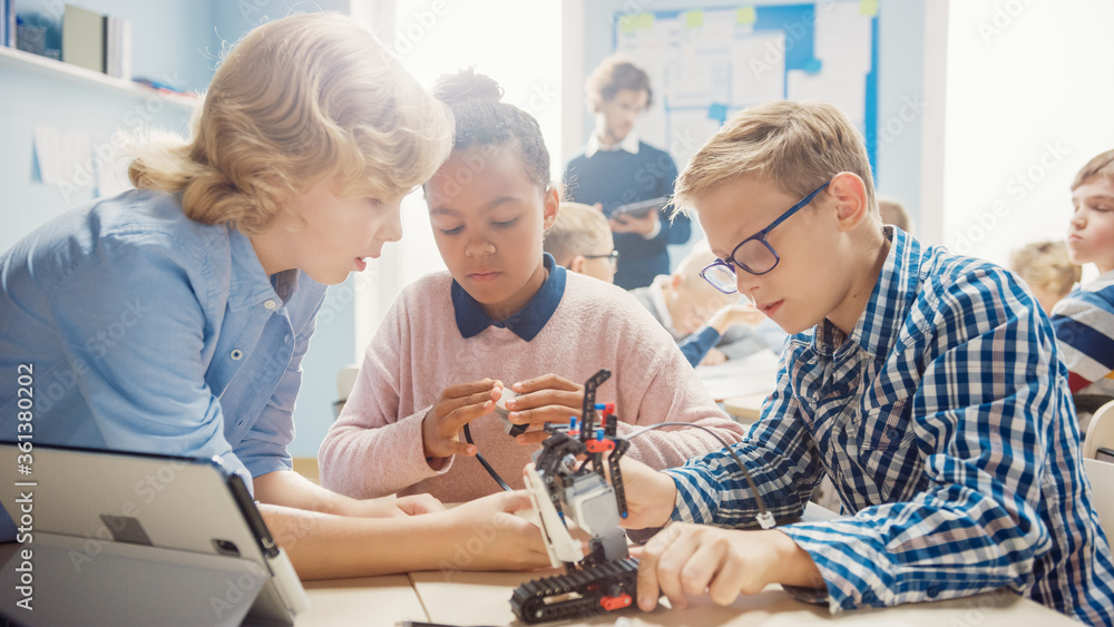 Poster elementary school robotics classroom: diverse group of brilliant children with enthusiastic teacher 