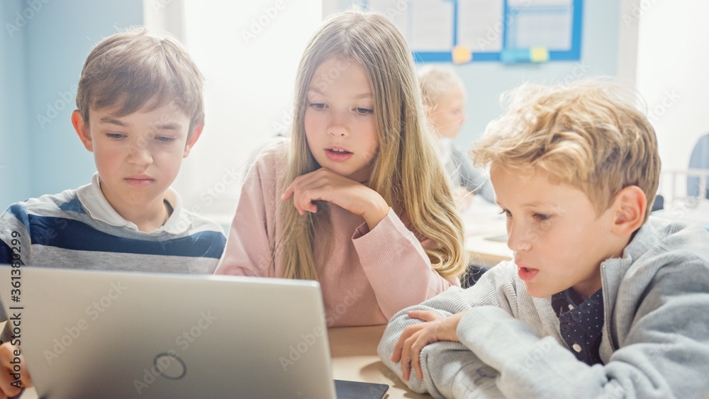 Poster elementary school classroom: diverse group of brilliant children using laptop computer for software 
