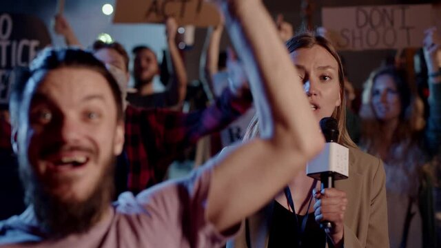 TV Journalist Woman Telling about Public Stike On-Air Broadcast. Funny Hipster Guy Trolling and Mocking Correspondent, Waving Hand at Camera. Fun Scene.