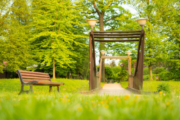 Park Michalov in spring. Bridge with bench. Low angle shot. Prerov city, Moravia, Czech republic.