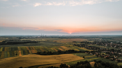 Fototapeta premium Ariel shot of sunset and beautiful fields