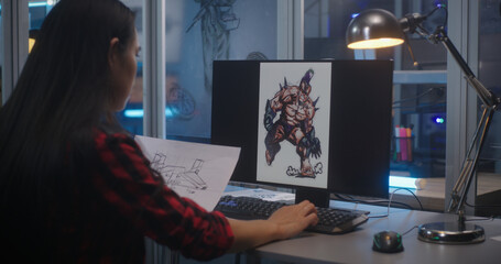 Female graphic designer sorting concept art