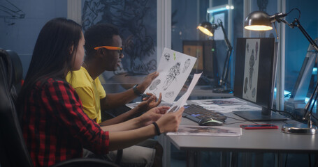 Designers discussing video game character creation © Framestock