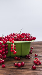 fresh summer red currant in a green bowl