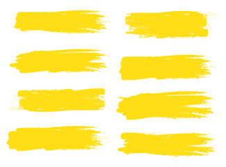 Yellow brush stroke set isolated on white background. Trendy brush stroke vector for ink paint, grunge backdrop, dirt banner, watercolor design and dirty texture. Brush stroke vector