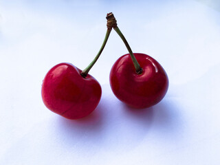 Cherries with leaves isolated on white background