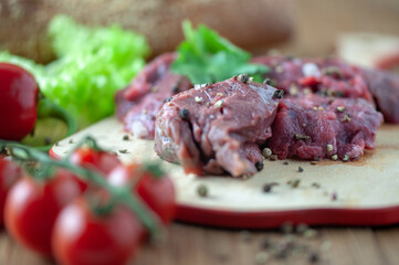 appetizing fresh meat with spices on a cutting Board