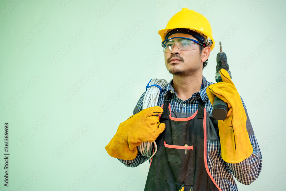 Poster electrician,smiling electrician in helmet and safety with cabling and tools on white background.