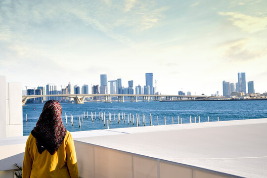 Girl Looking On Abu Dhabi Skyline From Louvre UAE 