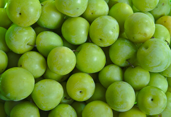 Green plums in spanish market