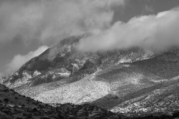 Winter mountain with a cloud and snow