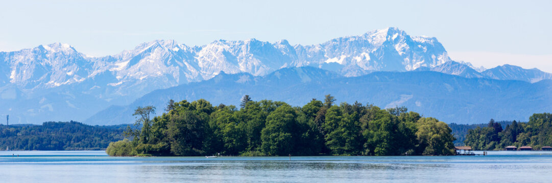 Panorama of Roseninsel (rose island) with bavarian alps in the background. 