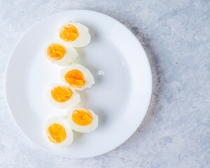 boiled eggs on a white plate top view