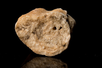 Beautiful Stalactite cut pattern inside structure for science and geology isolated on black background with reflection. Close up.