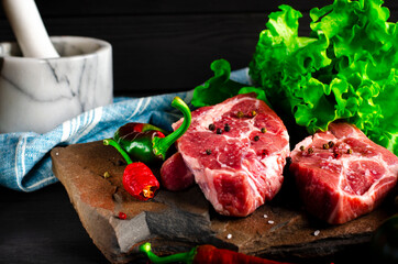 Raw meat beef marble steak with spices and vegetables
